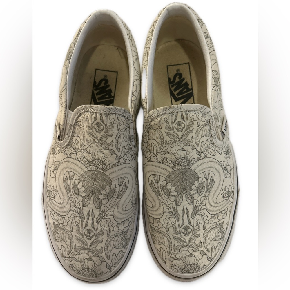 VANS• Slip on skater shoes, white with black floral design, women’s 7